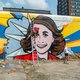 Een lachende Anne Frank uit liefde voor de stad