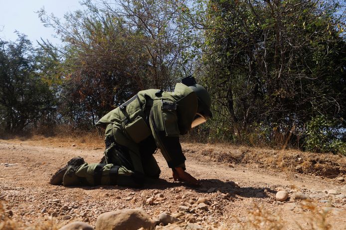 An army specialist defuses a roadside bomb.