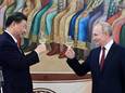 De Chinese president Xi Jinping en de Russische president Vladimir Poetin bij een receptie op het Kremlin.