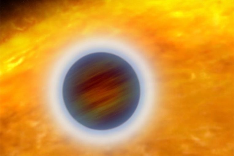 Tijdens een planeetovergang schijnt sterlicht door de dampkring van de planeet heen. (NASA) Beeld 