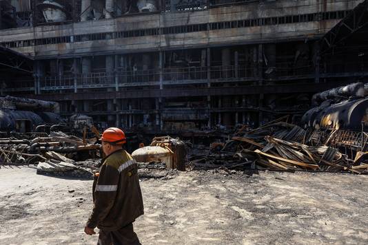 An employee walks at a thermal power plant heavily damaged by recent Russian missile strikes, amid Russia's attack on Ukraine, in an undisclosed location in Ukraine April 12, 2024. REUTERS/Valentyn Ogirenko
