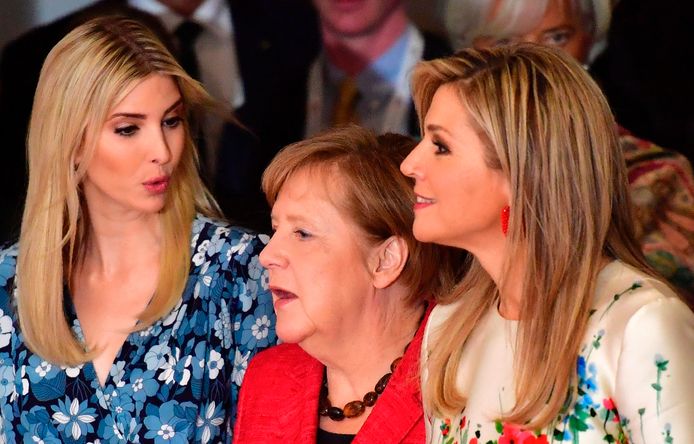 (L-R) First Daughter and Advisor to the US President Ivanka Trump, German Chancellor Angela Merkel and Queen Maxima of the Netherlands arrive to pose for a family photo during the W20 women's empowerment summit sponsored by the G20 Group of 20 major economic powers on April 25, 2017 in Berlin. / AFP PHOTO / John MACDOUGALL