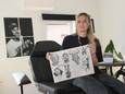Marie-Heleen Pype met enkele van haar ontwerpen in haar eigen tattoostudio Inkbarrel, boven barbiershop Gentlemen's Corner in Izegem.