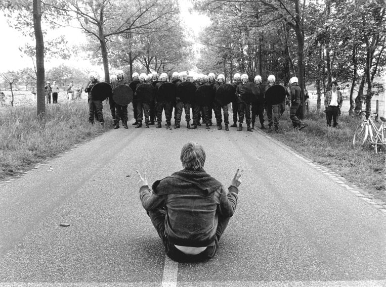 A protester sits on the Fokker access road in Woensdrecht, 1984. Riot police intervened shortly afterwards.  ANP image