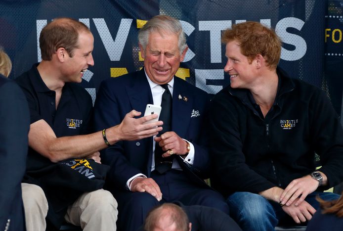 Prins William, koning Charles en prins Harry in 2014