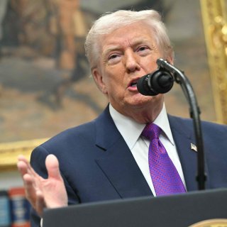 Smiling, Trump undermines nearly twenty years of American climate policy