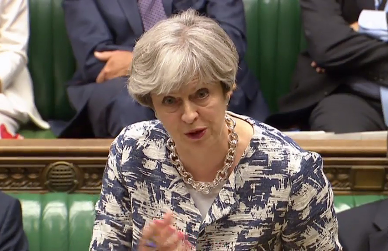 Premier May in het Britse parlement.  Beeld AFP