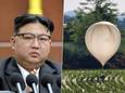 Le dirigeant nord coréen Kin Jong Un avec une image des ballons envoyé vers la Corée du sud.
