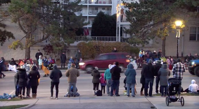 A live stream from the Facebook page of the city of Waukesha shows a red SUV passing by a crowd.  Shortly afterwards, the car collided head-on with the rear of the Christmas parade.