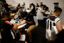 Fans of Brazilian team Atletico Mineiro get free tattoos offered by the company constructing the new stadium, as the team won the Brazilian Championship after 50 years, in Belo Horizonte, Brazil December 6, 2021. REUTERS/Ueslei Marcelino