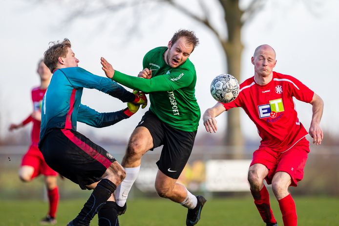 AR20220225-0017, AARLANDERVEEN, NETHERLANDS - FEBRUARY 26: (L-R) #1 Bram Heikoop (Gouda), #9 Jorn Poelwijk (Aarlanderveen), #3 Nick van der Elburg (Gouda) during the 3e Klasse-A match between Aarlanderveen and Gouda at Sportpark Polderpark on February 26, 2022 in Aarlanderveen, Netherlands