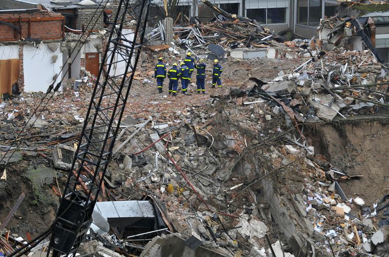 Het stadsarchief van Keulen stortte in 2009 in tijdens de aanleg van een metrolijn. Het Nederlandse bouwbedrijf Bam heeft recent een schikking getroffen voor zijn aandeel.  Beeld AFP