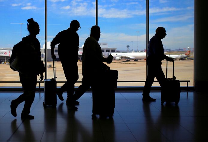 Des voyageurs à l'aéroport international de Sydney, en Australie, en 2017.