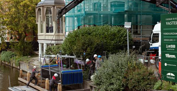 In het Amsterdamse water zit genoeg energie om tienduizenden huishoudens te verwarmen en te koelen – ook monumenten