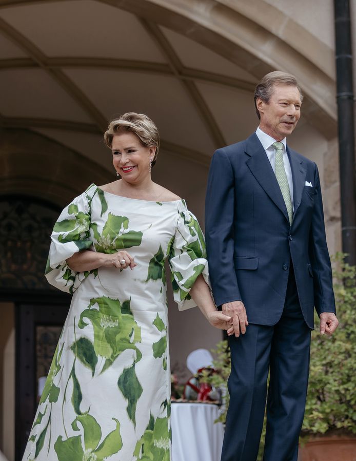 The Grand Duchess holds hands with her husband, Grand Duke Henry.
