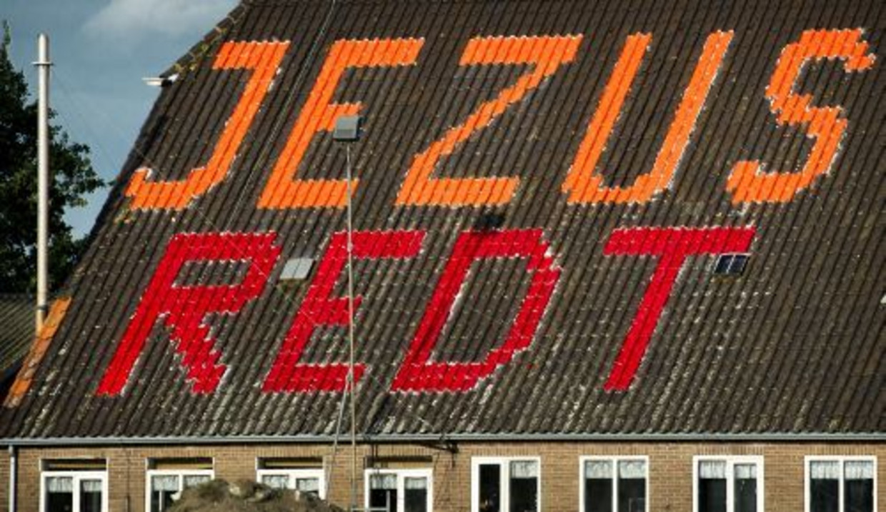 De letters op het dak van de boerderij nabij Gorinchem. ANP Beeld 