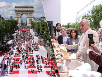KIJK. Duizenden inwoners van Parijs nemen deel aan gratis picknick op de Champs-Élysées