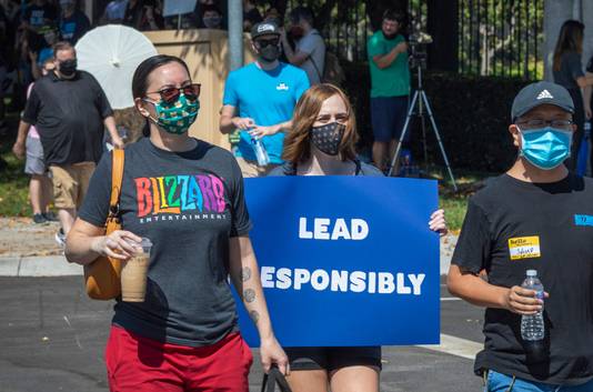 Employees of the video game company, Activision Blizzard, hold a walkout and protest rally to denounce the company’s response to a California Department of Fair Employment and Housing lawsuit and to call for changes in conditions for women and other marginalized groups, in Los Angeles on July 28, 2021.  (Photo by DAVID MCNEW / AFP)