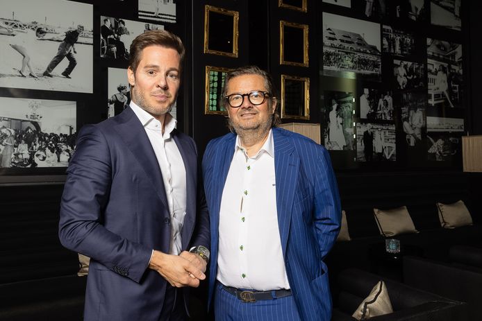 Versluys CEO Bart Versluys and Belgian businessman Marc Coucke shake hands at a press conference of the Scorpiaux and Alychlo holdings on the take-over of the Hotel La Reserve in Knokke-Heist, Tuesday 10 August 2021 in Knokke. BELGA PHOTO JAMES ARTHUR GEKIERE