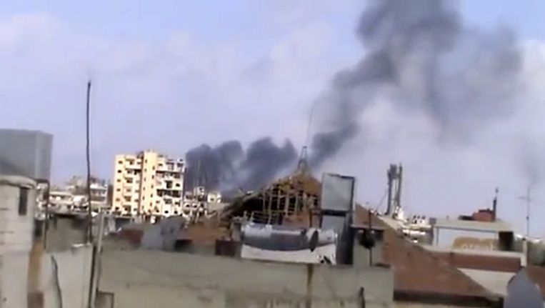 Gebombardeerde huizen in Homs. Beeld ap