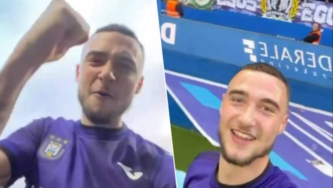 KIJK. RSCA-fan is door het dolle heen na zege en werpt gsm op veld, Debast gaat er al vierend mee aan de haal