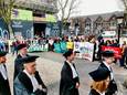 Hoogleraren lopen tijdens de jaarlijkse verjaardag (diës) van de Universiteit Utrecht van het Academiegebouw naar de Domkerk. Pro-Palestinademonstranten vragen aandacht voor de banden met Israël.