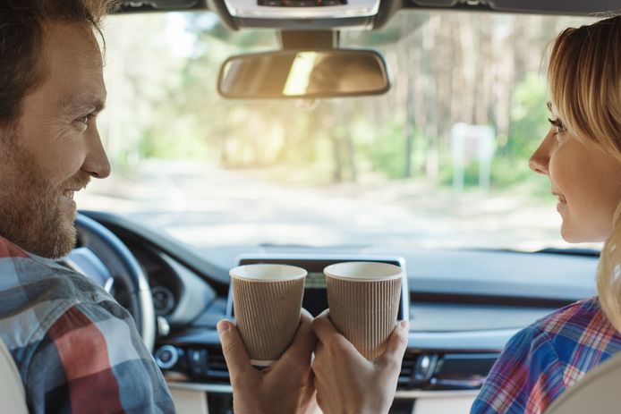 Travel by car family ride together couple drinking coffee