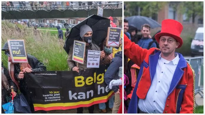 Links de actiegroep die vreedzaam tegen Zwarte Piet betoogde in Kortrijk, rechts mede-organisator Mario Dhont van de intrede van de Sint. Alles verliep rustig