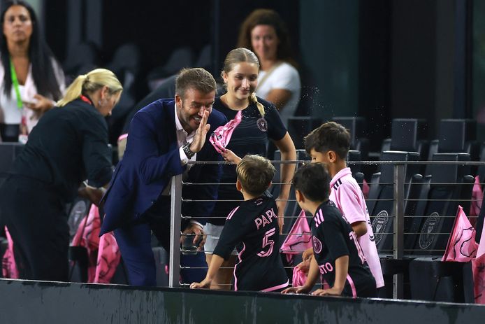 David Beckham, co-owner of Inter Miami, with a high five for Messi's sons.