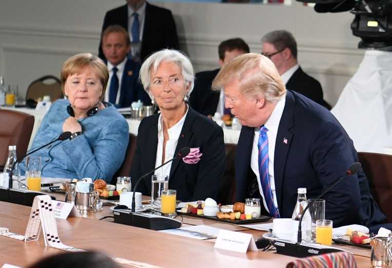 De Duitse bondskanselier Angela Merkel, IMF-directeur Christine Lagarde en de Amerikaanse president Donald Trump vorig jaar juni bij een G7-top in Canada.  Beeld EPA