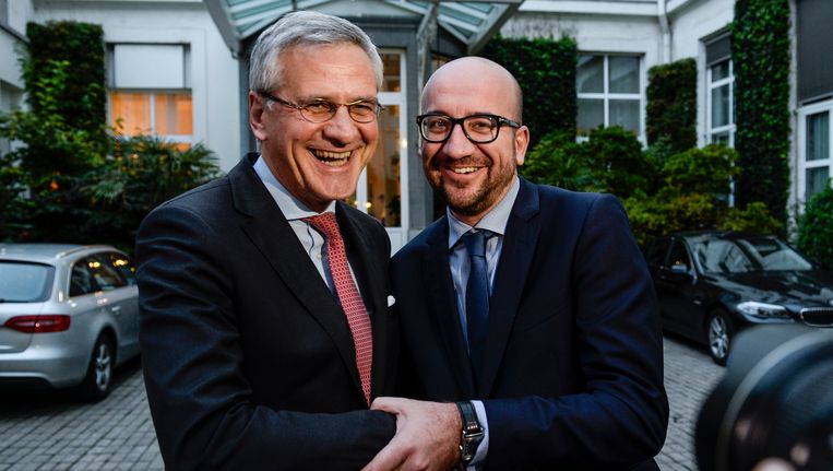Co-formateurs Kris Peeters en Charles Michel na de deal over een regeerakkoord en de begroting Beeld BELGA