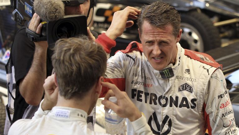 Sebastian Vettel (l) met Michael Schumacher. Beeld ap