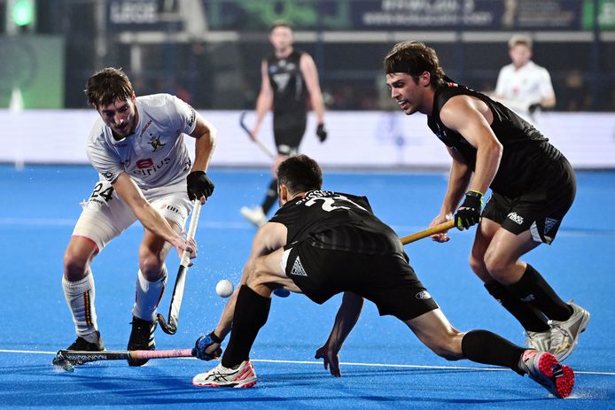 Antoine Kina of Belgium, Kane Russell of New Zealand and Aidan Sarikaya of New Zealand pictured in action during a game between the Red Lions of Belgium and New Zealand, a quarter-final match at the FIH World Cup of Hockey 2023 in Bhubaneswar, India, on Tuesday January 24, 2023. PHOTO BELGA DIRK WAEM