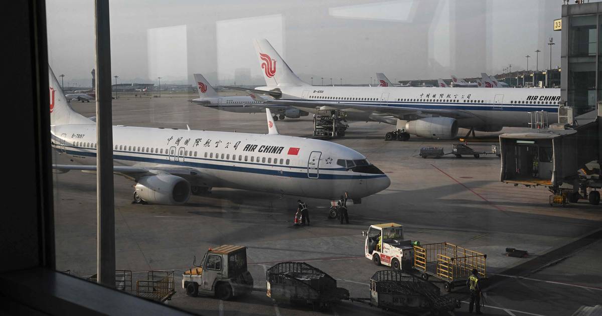 An Air China plane made an emergency landing after an engine fire and nine minor injuries  outside