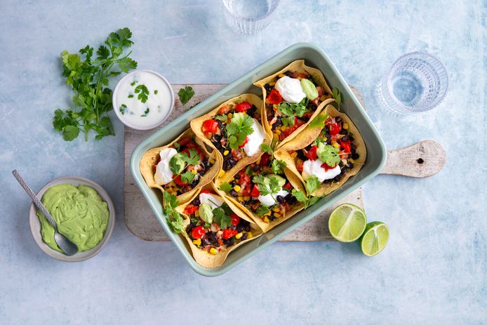 Oven baked tacos with avocado mousse and lime yogurt.