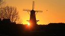 Molen Kyck over den Dyck tijdens zonsondergang.