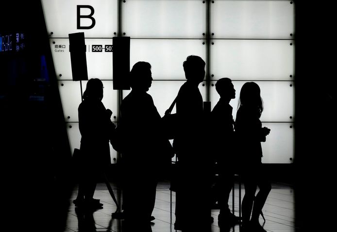 Passagiers op de internationale luchthaven van Tokio.