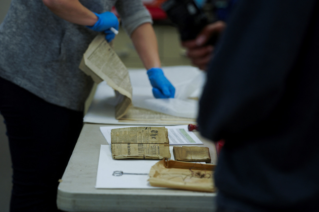 Newspaper found in the time capsule.  Reuters photo