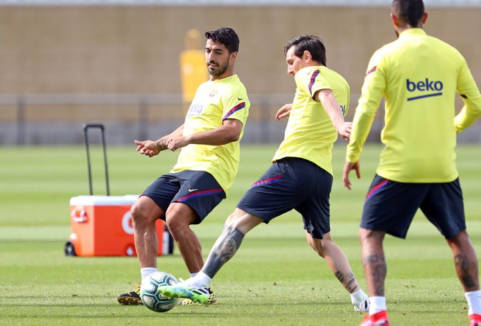Suárez en Messi op de training bij FC Barcelona.
