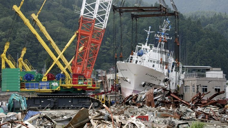 Een groot deel van Japan is totaal verwoest na de tsunami en aardbeving in maart dit jaar. © ANP Beeld 