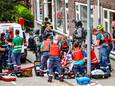 Speciale eenheden van de politie en brandweer bij een uitslaande brand in een pand aan het Heiman Dullaertplein.
