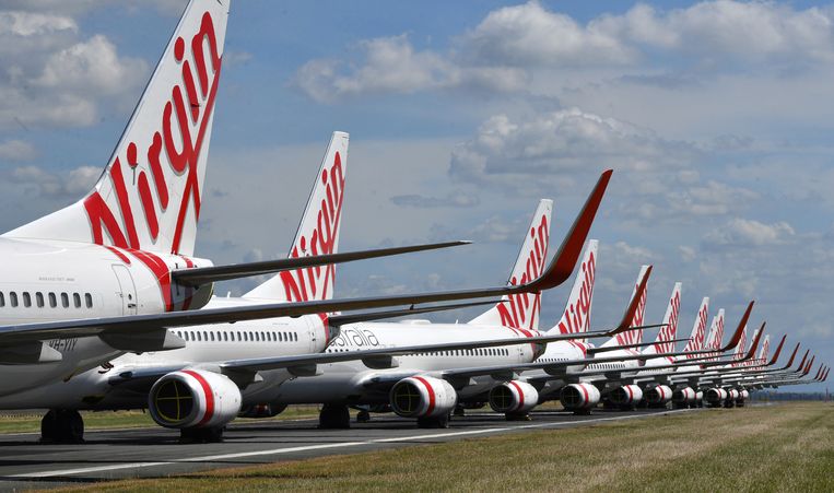 Vliegtuigen van Virgin Australia aan de grond in Brisbane. Beeld AP