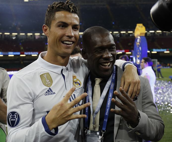 Cristiano Ronaldo viert met Clarence Seedorf zijn vierde CL-winst.