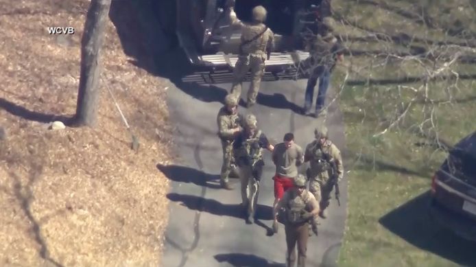 Jack Teixeira, in a red T-shirt and shorts, is led away;  today he must avoid.